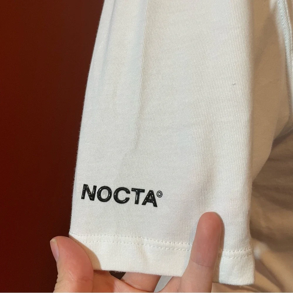Nike x Nocta Men’s‎ White Drake Center Swoosh Athletic Slim Crewneck Tee Shirt